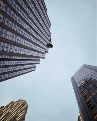 skyscraper building with blue sky in the background