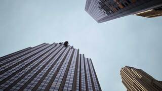 skyscraper building with blue sky in the background