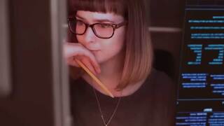 Person studying at computer screen with pencil in hand.